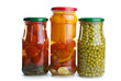 Three glass jars with marinated vegetables