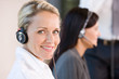 Foto: Smiling businesswoman wearing headset Smiling businesswoman wearing headset