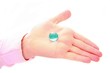 hand holding clear blue stone