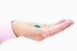 hand holding clear blue stone