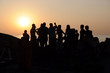 Silhouette dance team people. sunset on the sea