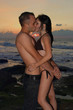 Romantic couple kissing at sunset