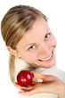 female smiling and holding a fruit