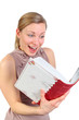 girl looking excited into a photo album
