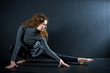 ballerina stretching in studio ballerina stretching in studio