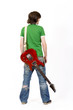 back of a guitarist with electric guitar back of a guitarist with electric guitar