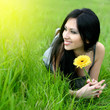 beautiful young woman relaxing in the grass
