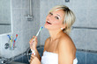 girl in bathroom with toothbrush