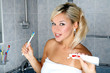 girl in bathroom with toothbrush