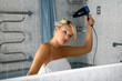 girl in bathroom with drier