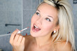 girl in bathroom with liquid lipstick