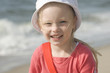 Smiling cheerful girl on the beach II