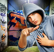 Cool looking hooligan in a graffiti painted gateway Cool looking hooligan in a graffiti painted gateway