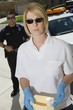 Police Officer with Evidence Envelope
