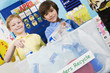 Elementary Students with Recycling Container