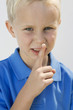 Boy with Finger on Lips