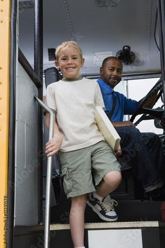 Photo: Little Boy Getting off of Schoolbus Little Boy Getting off of Schoolbus