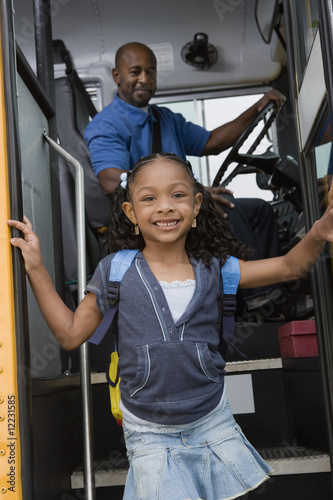 Photo: Little Girl Getting off of Schoolbus Little Girl Getting off of Schoolbus