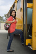 Teenage Girl Getting on School Bus