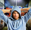 Cool looking hooligan in a graffiti painted gateway Cool looking hooligan in a graffiti painted gateway