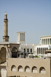 Photo: uae, dubai, old windtowers and minaret of the grand mosque in bur dubai uae, dubai, old windtowers and minaret of the grand mosque in bur dubai