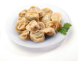 Ravioli on the plate on white background Ravioli on the plate on white background