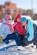 Mother with son and daughter at the skating rink