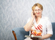 The mature woman with phone