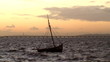 Fishing boat in rough sea at sunset Fishing boat in rough sea at sunset