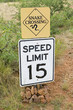 Snake crossing and speed limit signs. Snake crossing and speed limit signs.