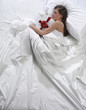 woman in bed with his present
