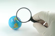 Earth globe & human hand