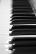 Keys of a piano with only 1 key in focus