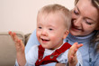 Mother hold handicapped boy
