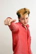 Sured guy point his finger on camera over white background