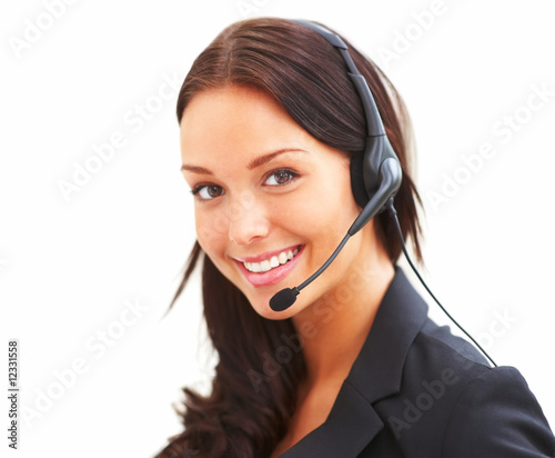 Foto: Portrait of happy young female with headset Portrait of happy young female with headset