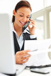 Confident businesswoman in black suit speaking on phone