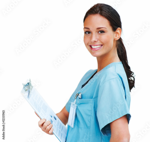 Foto: Beautiful nurse smiling on a white background Beautiful nurse smiling on a white background