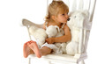Young Girl on A Chair Kissing a Teddy Bear Young Girl on A Chair Kissing a Teddy Bear