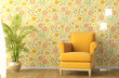 interior with armchair and flowery wallpaper