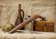 Pistol, bottle, rapier and trunk