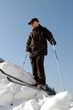 Photo: Man-skier on high snow mountain Man-skier on high snow mountain