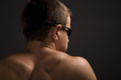 young sporty man over black background