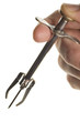 antique olive grabber with hand isolated