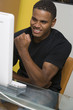 Young Man Using Desktop Computer