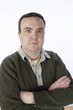 Overweight mid-adult man standing with arms crossed, portrait