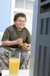 boy eating bowl of fruit