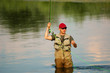 Fisherman angling on the river