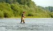 Fisherman angling on the river