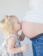 Little Girl Kissing New Sibling to Be Little Girl Kissing New Sibling to Be